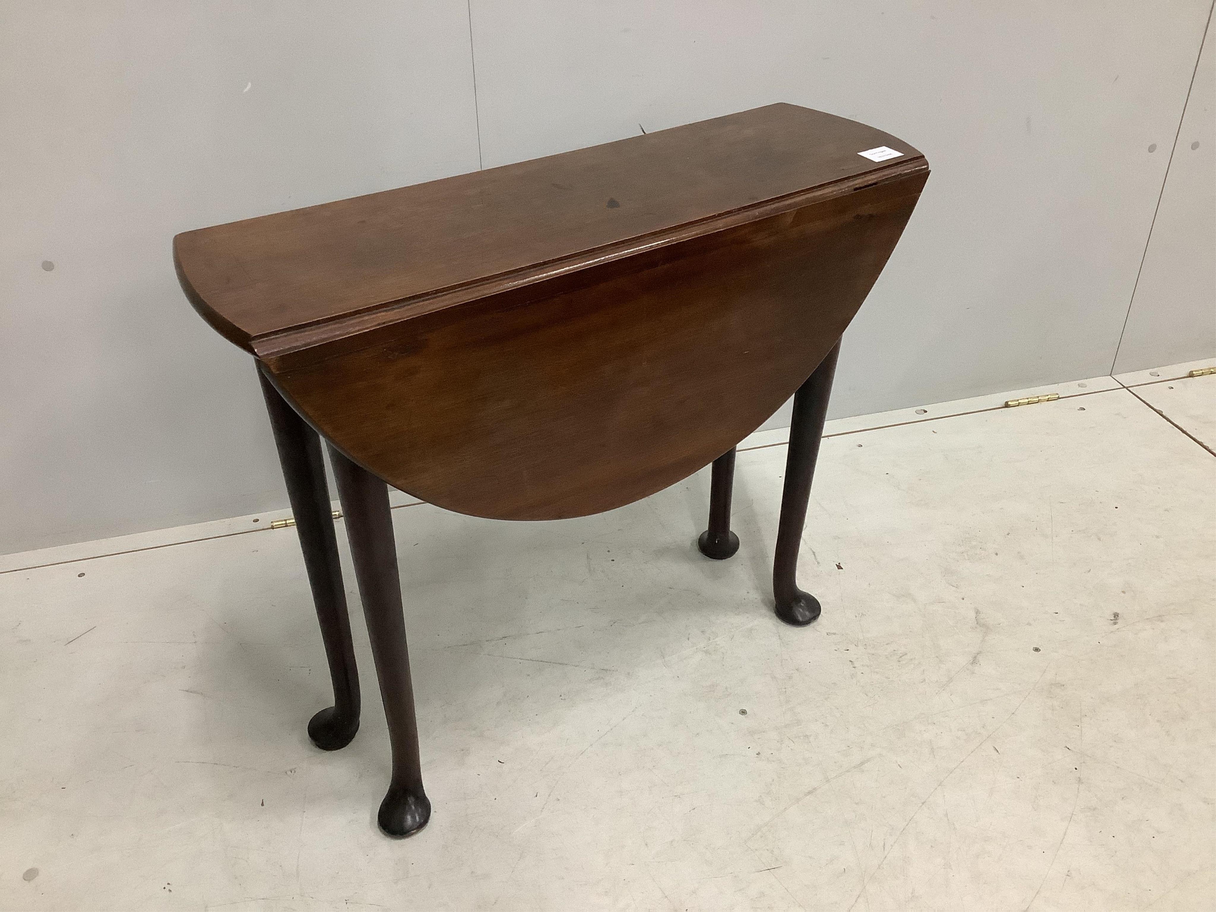 A small George III mahogany cottage drop leaf pad foot table, 85cm extended, depth 80cm, height 69cm. Condition - fair